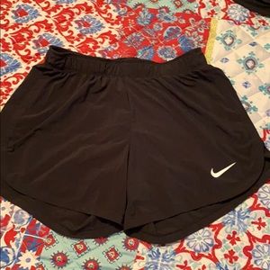 Black Nike running shorts